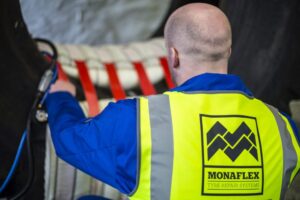 Man working with Monaflex Tyre Repair System in a tyre repair workshop